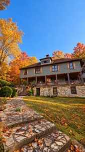 Beechwood Inn Autumn Farmhouse and Stone Path - Beechwood Inn | Clayton, GA | Bed & Breakfast Stone garden path leading to Beechwood Inn beneath orange and gold autumn trees