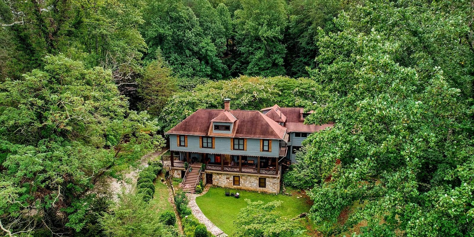 Beechwood Inn Summer Woodland Aerial View Aerial view of Beechwood Inn nestled among lush green summer trees