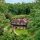 Aerial view of Beechwood Inn nestled among lush green summer trees