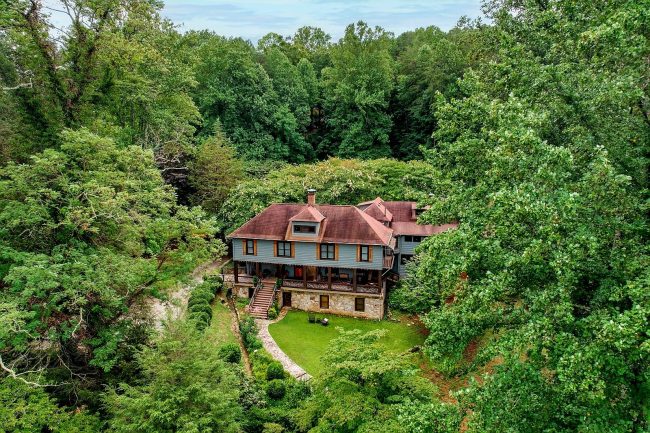 Aerial view of Beechwood Inn nestled among lush green summer trees