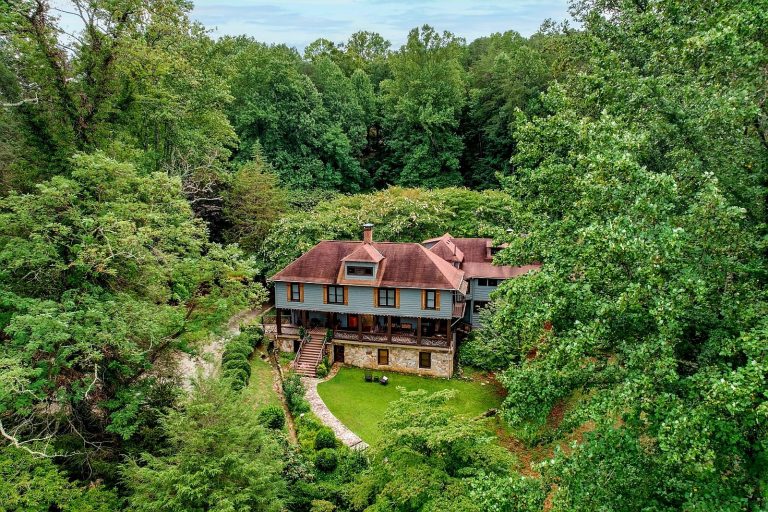 Aerial view of Beechwood Inn nestled among lush green summer trees
