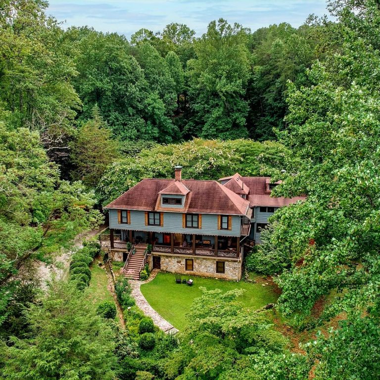 Aerial view of Beechwood Inn nestled among lush green summer trees
